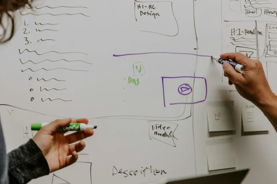 Sketching website wireframes on a whiteboard